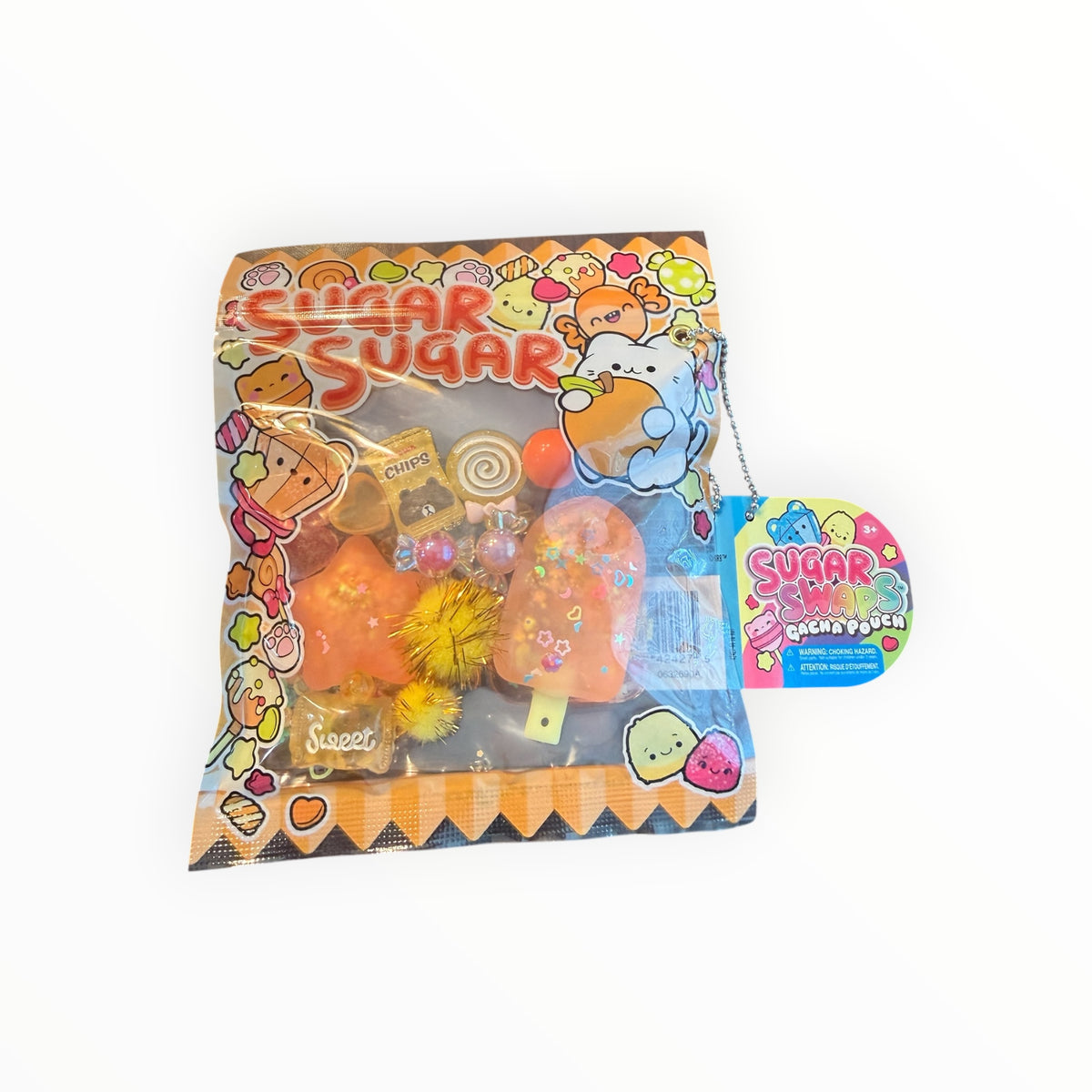 Southern Charm Collectibles Sugar Swap Gacha Pouch with orange snack-themed charms, glitter, and candy accessories.