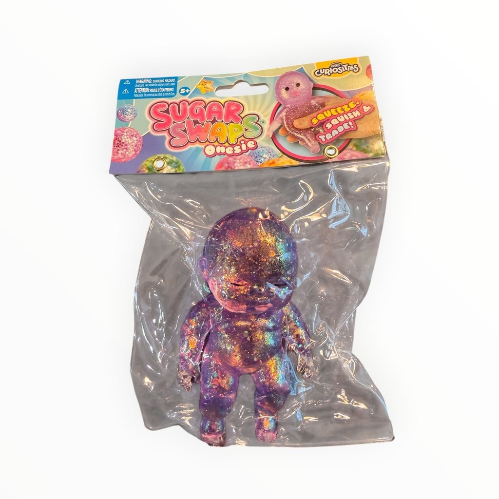 Southern Charm Collectibles Sugar Swaps Onesie purple glittery squishy baby doll toy in original retail packaging